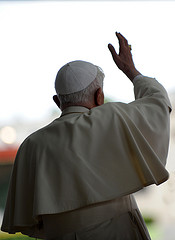 Pope Benedict XVI prays in front of the image ...