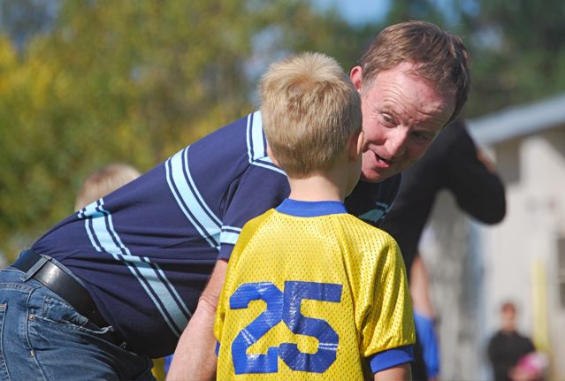 Coach encourages young athlete