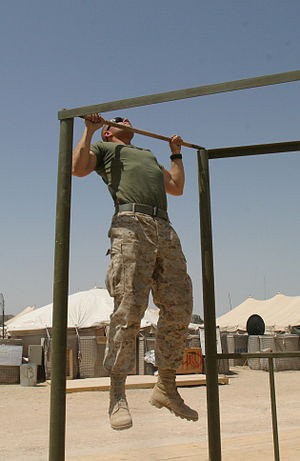 A US Marine Doing Pull-ups.