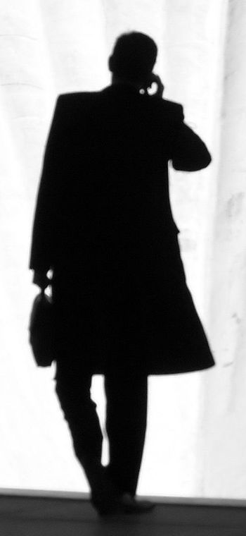 A businessman's silhouette. A businessman's silhouette.