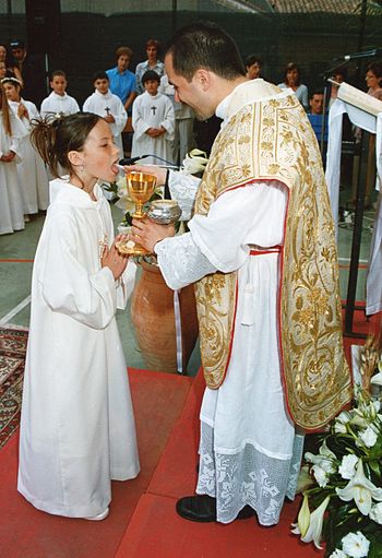 Girl receiving first Holy Communion, Sicily